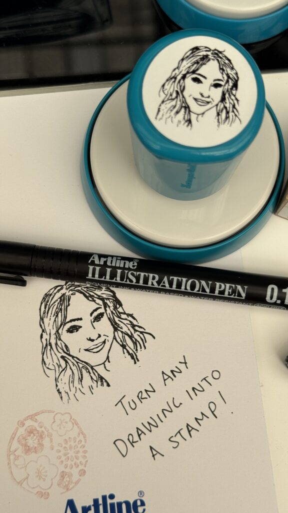 Xstamper QuiX custom stamps made any design into a stamp at London Stationery Show in just minutes-- even a drawing of a face!